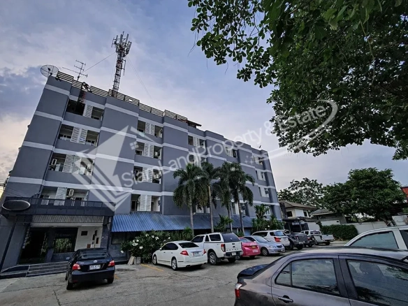 Nopnuan Mansion Apartment Ramintra main low-rise building exterior under the twilight sky