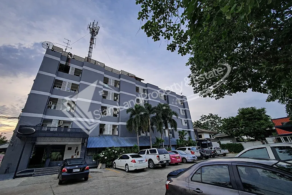 Nopnuan Mansion Apartment Ramintra main low-rise building exterior under the twilight sky