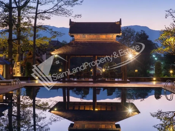 Sibsaen Luxury Rimping Hotel stunning riverside swimming pool and traditional Lanna pavilion under twilight sky