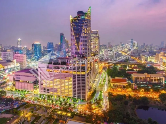 The Bazaar Hotel Bangkok colorful high rise building exterior view at sunset
