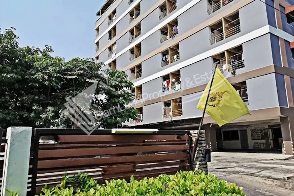Veerach Place Apartment main low-rise residential building exterior featuring a secure gated front entrance