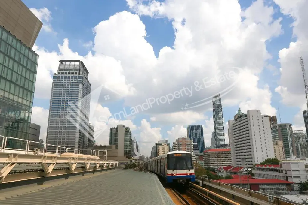 Stunning daytime cityscape view from the street overlooking high-rise buildings and blue skies
