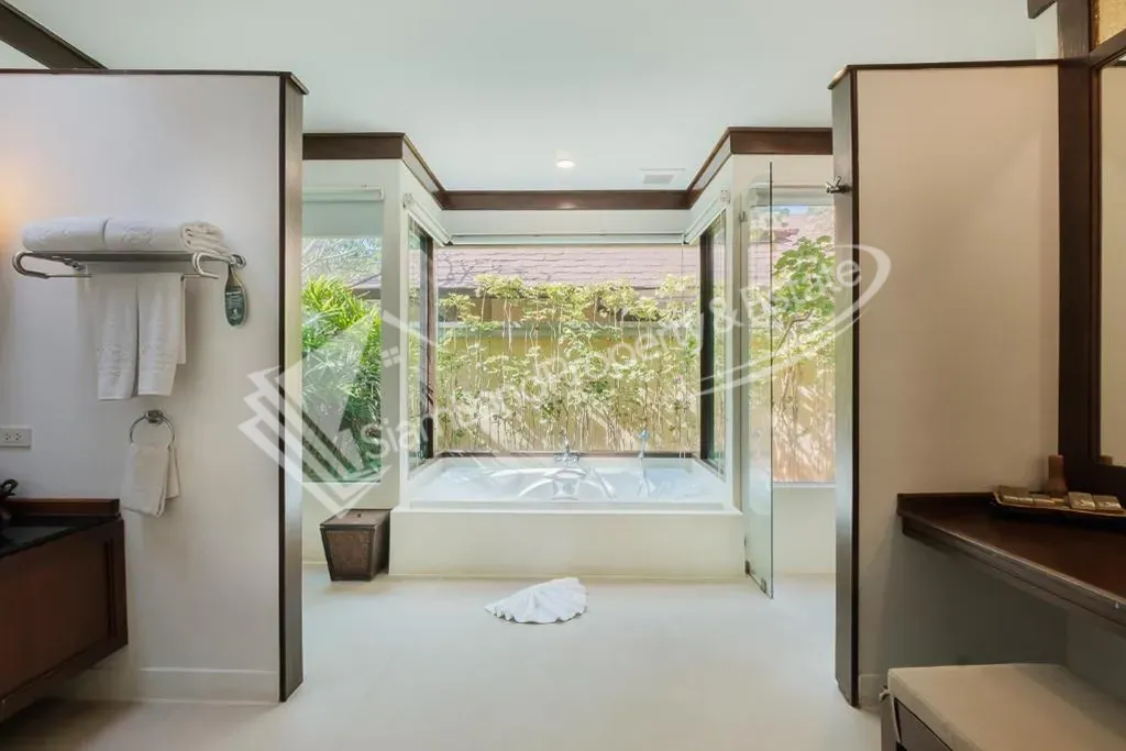 Spacious open concept villa bathroom with premium fixtures and bathtub